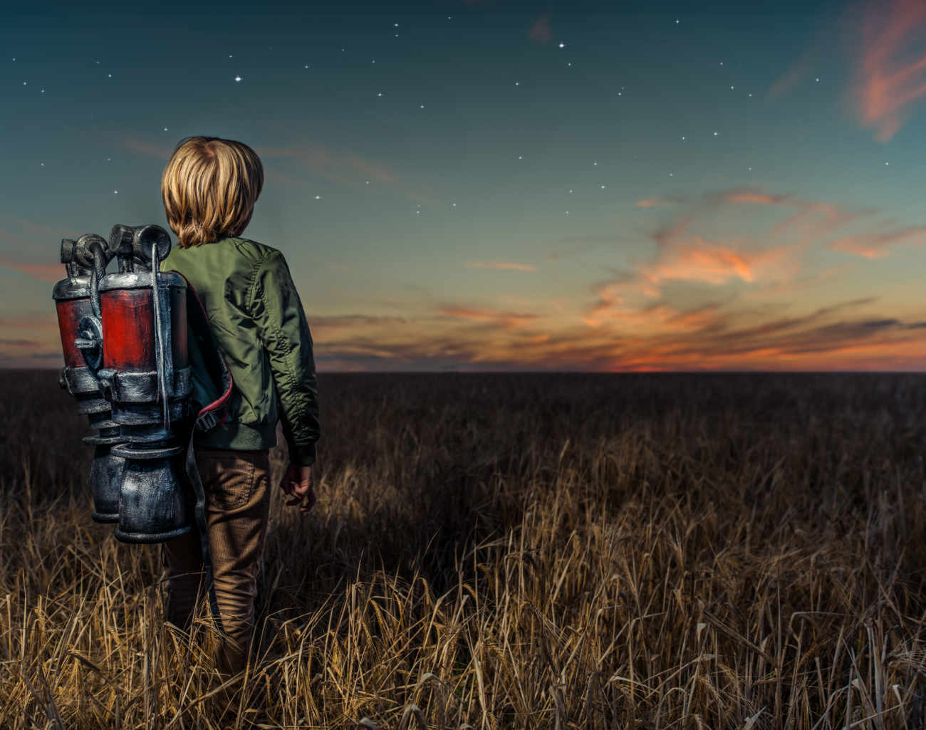 Creative marketing vs marketing data - image of boy in field with backpack