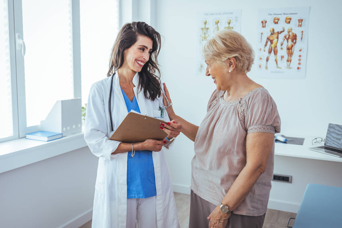 Doctor with patient at a GP surgery