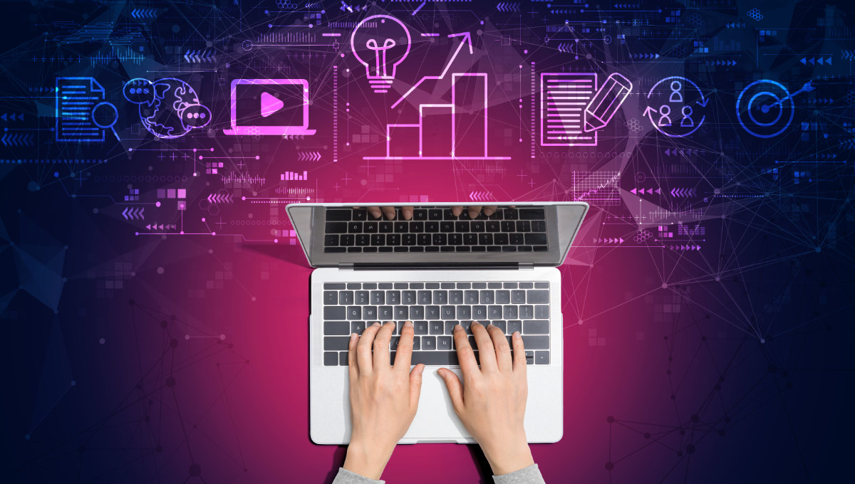 Running an AI visibility audit - hand on a laptop keyboard