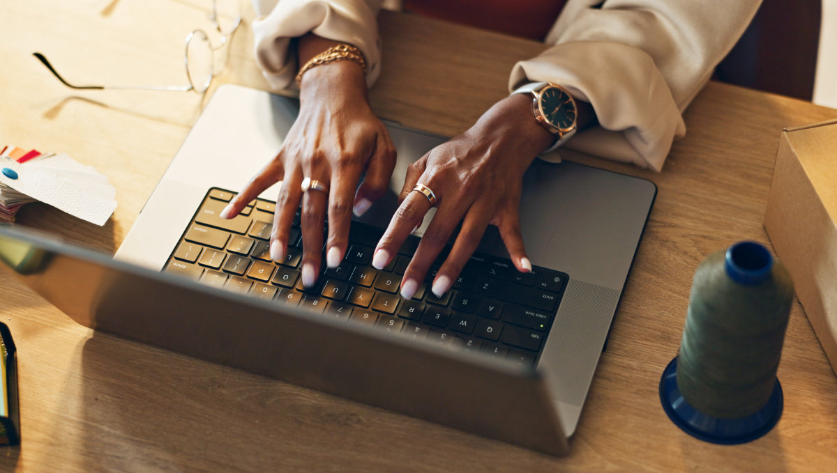 Upskill your content team - a writer working on content using a laptop